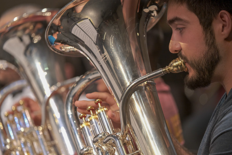 Close-up of a TAMUK Bands musician playing a silver euphonium